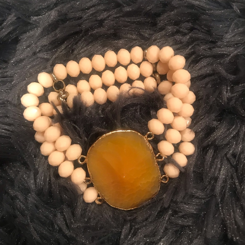 Great fall triple bracelet with apricot stone center.